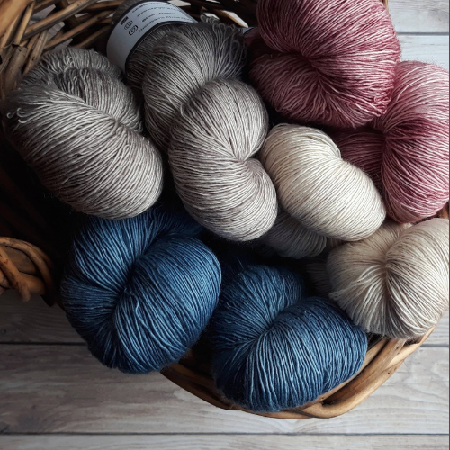 beautiful yarn in soothing color palate showing the kind of products we sell for creators to make gorgeous clothing items